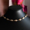 Choker dourado de búzios